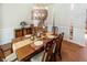Formal dining room featuring hardwood floors and a stylish light fixture at 5129 Bartons Enclave Ln, Raleigh, NC 27613
