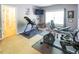 Spacious exercise room with various equipment, including a stationary bike, weight bench, and inversion table at 5129 Bartons Enclave Ln, Raleigh, NC 27613
