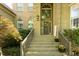 Inviting front entrance with detailed brickwork, wooden door and decorative wreath at 5129 Bartons Enclave Ln, Raleigh, NC 27613