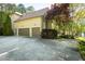 Spacious three-car garage with ample parking space and a well-maintained driveway at 5129 Bartons Enclave Ln, Raleigh, NC 27613