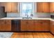 Modern kitchen with stainless steel appliances, granite countertops, and ample cabinet space at 5129 Bartons Enclave Ln, Raleigh, NC 27613