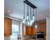 Kitchen boasts pendant lighting and stainless-steel appliances, seamlessly blending functionality with style at 5129 Bartons Enclave Ln, Raleigh, NC 27613
