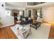 Spacious living room with hardwood floors flowing into the dining and kitchen areas at 5129 Bartons Enclave Ln, Raleigh, NC 27613