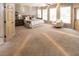 Spacious main bedroom with plush carpeting, a ceiling fan, and multiple windows letting in natural light at 5129 Bartons Enclave Ln, Raleigh, NC 27613