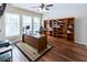 Spacious office with large windows, hardwood floors, built-in bookshelves, and ample workspace at 5129 Bartons Enclave Ln, Raleigh, NC 27613