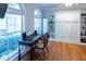 Bright office with hardwood floors, built-in storage, and a large window offering ample natural light at 5129 Bartons Enclave Ln, Raleigh, NC 27613