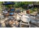 Outdoor patio area featuring multiple seating arrangements, a table, and stone pavers at 5129 Bartons Enclave Ln, Raleigh, NC 27613