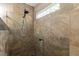 Stylish walk-in shower featuring decorative tile, mosaic accents, and a built-in niche at 5129 Bartons Enclave Ln, Raleigh, NC 27613