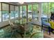 Relaxing sunroom offering ample natural light and access to the outdoor space at 5129 Bartons Enclave Ln, Raleigh, NC 27613