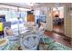 Cozy sunroom featuring a glass table, comfortable seating, a rug, and access to a patio area at 5129 Bartons Enclave Ln, Raleigh, NC 27613