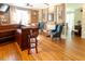 Comfortable wet bar area with dark wood finishes, brick accents, and natural light at 5129 Bartons Enclave Ln, Raleigh, NC 27613