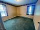 Bedroom with carpet flooring and windows providing natural light and ventilation at 543 Stockyard Rd, Staley, NC 27355