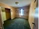 Bedroom with carpet flooring, closet and unique sports themed wall decor at 543 Stockyard Rd, Staley, NC 27355