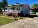 Charming single-story home with covered porch, landscaped yard and brick foundation at 543 Stockyard Rd, Staley, NC 27355