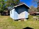 Exterior view of a shed with double doors in a grassy yard at 543 Stockyard Rd, Staley, NC 27355
