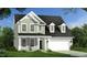 Charming two-story home featuring a lush lawn and attached two-car garage at 567 Winding Creek Dr, Lillington, NC 27546