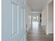 Bright foyer with hardwood floors leading into an open-concept home with natural light at 567 Winding Creek Dr, Lillington, NC 27546