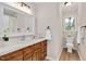 Bathroom features wood-look floors, vanity with sink, neutral walls, and a window at 603 Warren Rd, Erwin, NC 28339