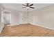 Bedroom featuring wood-look floors, neutral paint, and two closet doors, and a door to the bathroom at 603 Warren Rd, Erwin, NC 28339