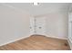 Bright bedroom featuring light hardwood floors and neutral paint, creating a serene and inviting space at 603 Warren Rd, Erwin, NC 28339