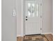 Close-up of a modern white front door with decorative glass panels and stylish hardware at 603 Warren Rd, Erwin, NC 28339