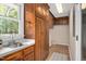 The laundry room featuring built-in wood cabinets and ample storage space to make cleaning a breeze at 603 Warren Rd, Erwin, NC 28339
