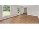 Bright and airy living room featuring wood-look flooring and large windows with natural light at 603 Warren Rd, Erwin, NC 28339