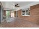 Cozy sunroom with brick walls, tile floors, and ample natural light at 603 Warren Rd, Erwin, NC 28339