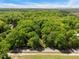 Aerial view showcasing surrounding lush greenery and landscape at 606 Dennys Store Rd, Roxboro, NC 27574