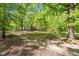 Expansive backyard showcasing the home's exterior and ample outdoor space at 606 Dennys Store Rd, Roxboro, NC 27574