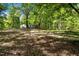 Expansive backyard showcasing the home's exterior and ample outdoor space at 606 Dennys Store Rd, Roxboro, NC 27574