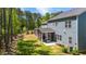 Exterior shot of a home featuring a spacious backyard and screened-in porch at 608 Cormiche Ln, Wake Forest, NC 27587