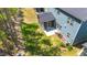Aerial view of a spacious backyard with lush lawn, screened porch, and garden area at 608 Cormiche Ln, Wake Forest, NC 27587