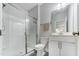 Modern bathroom with glass enclosed shower and sleek white cabinets at 608 Cormiche Ln, Wake Forest, NC 27587