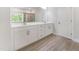 Bright bathroom featuring double vanity, tiled floors, and walk-in shower with glass door at 608 Cormiche Ln, Wake Forest, NC 27587