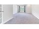 Spacious carpeted bedroom with a window view at 608 Cormiche Ln, Wake Forest, NC 27587