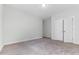 Neutral bedroom with carpet floors and white trim at 608 Cormiche Ln, Wake Forest, NC 27587