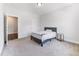 Bright bedroom featuring neutral walls, carpet flooring, and furniture at 608 Cormiche Ln, Wake Forest, NC 27587