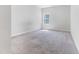 Bedroom filled with natural light offering neutral walls, carpet, and a bright window at 608 Cormiche Ln, Wake Forest, NC 27587