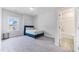 Cozy bedroom with a bed, a bedside table, and access to a bathroom at 608 Cormiche Ln, Wake Forest, NC 27587