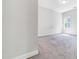 Bright bedroom featuring neutral walls, carpet flooring, and a window with natural light at 608 Cormiche Ln, Wake Forest, NC 27587