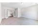Versatile bonus room featuring an entry and neutral carpet perfect for customization at 608 Cormiche Ln, Wake Forest, NC 27587