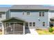 Rear exterior of home with screened in porch at 608 Cormiche Ln, Wake Forest, NC 27587