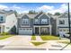 Inviting two-story home showcasing a well-kept front yard, attached garage, and appealing exterior at 608 Cormiche Ln, Wake Forest, NC 27587