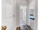 Bright hallway with hardwood floors leading to bedrooms and offering easy access throughout the home at 608 Cormiche Ln, Wake Forest, NC 27587