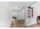 Hallway with hardwood floors, white trim and a view into the living room creates an open and inviting space at 608 Cormiche Ln, Wake Forest, NC 27587