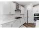 Well-equipped kitchen features white cabinets, stainless steel appliances, and stylish subway tile backsplash at 608 Cormiche Ln, Wake Forest, NC 27587