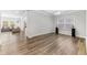 Open-concept room with hardwood floors and lots of natural light at 608 Cormiche Ln, Wake Forest, NC 27587