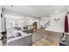 Spacious living room with hardwood floors, recessed lighting, and a comfortable grey couch at 608 Cormiche Ln, Wake Forest, NC 27587