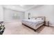 Spacious main bedroom features tray ceilings and a comfortable bed at 608 Cormiche Ln, Wake Forest, NC 27587